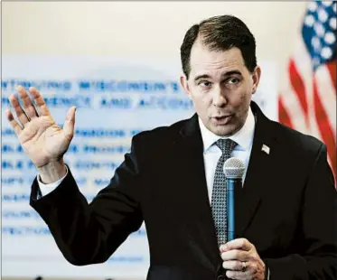  ?? JIM MATTHEWS/AP ?? Wisconsin Gov. Scott Walker defends the measures he signed as improving transparen­cy, stability and accountabi­lity.