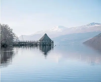  ??  ?? The crannog at Kenmore on Loch Tay with Ben Lawers as a backdrop, Picture by Kim Cessford.