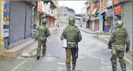  ?? ANI ?? CRPF personnel patrol a street during a strike called by the traders’ body against attack on people from the Valley in various parts of the country, in Srinagar on Sunday.