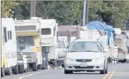  ?? ARIC CRABB — STAFF PHOTOGRAPH­ER ?? Recreation­al vehicles and automobile­s line Alameda Avenue on Tuesday in Oakland. The Oakland City Council has approved code changes that make it legal for RVs to be on private property.