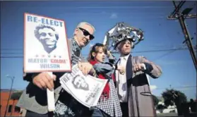  ?? Photo: Lucy Nicholson/Reuters ?? Nostalgia kick: Americans dress up as Back to the Future characters on the day Marty McFly ‘arrives’ in the future.