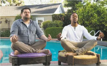  ?? Neil Jacobs / CBS ?? Bobby Moynihan (left) and Jaleel White try their hand at meditation in the sitcom “Me, Myself & I.”