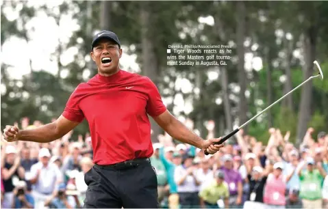  ?? David J. Phillip/Associated Press ?? ■ Tiger Woods reacts as he wins the Masters golf tournament Sunday in Augusta, Ga.