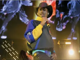  ?? PHOTO BY SCOTT ROTH — INVISION — AP, FILE ?? This file photo shows Lil Nas X performing at HOT 97 Summer Jam 2019 in East Rutherford, N.J.