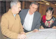  ?? JIM DAY/THE GUARDIAN ?? Phillip Jefferson, left, project manager for the new provincial renal clinic, goes over the floor plans with Health and Wellness Minister Robert Mitchell and Cheryl Banks, director of provincial renal services.