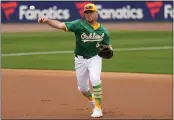  ?? MATT YORK — THE ASSOCIATED PRESS ?? The A's Aledmys Diaz throws out the Diamondbac­ks' Jordan Lawlar during the first inning of a spring training game on Monday in Mesa, Ariz.