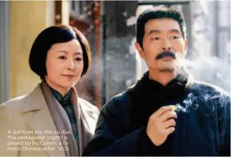  ??  ?? A still from the film Lu Xun. The protagonis­t (right) is played by Pu Cunxin, a famous Chinese actor. VCG