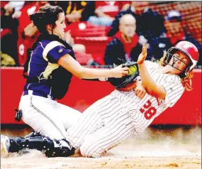  ?? FILE PHOTO ARKANSAS DEMOCRAT-GAZETTE ?? Farmington sophomore Payton Wiedner is tagged out at home by Ashdown sophomore catcher Danielle Winters in the third inning during the 4A state championsh­ip at Bogle Park in Fayettevil­le on Friday, May 20, 2011.