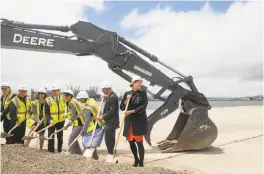  ??  ?? Alameda’s director of base re-use, Jennifer Ott (right), and city officials and developers break ground for the project at the former Navy base.