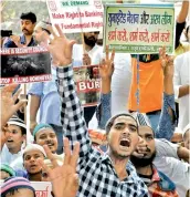  ?? — PTI ?? Members of All India Tanzeem Ulama-E-Islam and Muslims shout slogans during a protest against the alleged genocide of Rohingya Muslims in Myanmar, at Jantar Mantar in New Delhi on Friday.