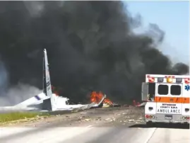  ?? JAMES LAVINE VIA AP ?? Flames and smoke rise from an Air National Guard C-130 cargo plane after it crashed near Savannah, Ga., on Wednesday.