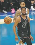  ?? GERRY BROOME/ASSOCIATED PRESS ?? Team LeBron’s Dwayne Wade moves toward the ball against Team Giannis during the first half of the All-Star game Sunday in Charlotte, N.C.