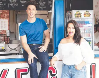  ?? Picture: AAP ?? THEY RULE: Jake and Elle Harrison at their Eat Street stall in Brisbane.