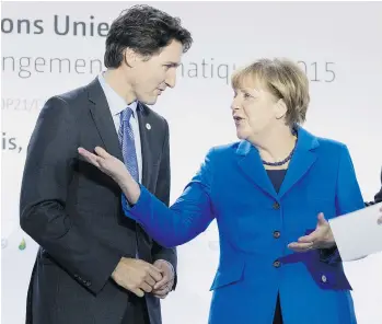  ?? ADRIAN WYLD/THE CANADIAN PRESS ?? Prime Minister Justin Trudeau chats with German Chancellor Angela Merkel in Le Bourget, France.