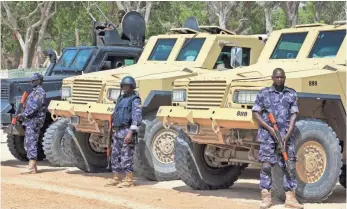  ?? FARAH ABDI WARSAMEH, AP ?? Soldiers stand guard near a checkpoint Tuesday on the eve of a landmark presidenti­al election in Mogadishu, Somalia. Fears of violence have the capital on lockdown.