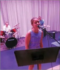  ??  ?? Bianka Gebhardt, 12, sings “The Logical Song” by Supertramp during Rock Camp rehearsals on July 28at the Oneida High School. The group of area students will perform a live concert in the school’s auditorium on Aug. 5.