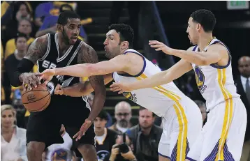  ?? — GETTY IMAGES FILES ?? The Golden State Warriors hounded San Antonio’s LaMarcus Aldridge, left, in the first two games of the NBA Western Conference Finals in Oakland. Aldridge had just eight points in Game 2, and the Spurs lost 136-100.