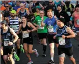  ??  ?? Runners taking part in Sunday’s KBC Dublin Marathon.