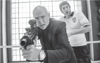  ?? COLUMBIA PICTURES ?? Mark Strong, front, and Sacha Baron Cohen star in The Brothers Grimsby.