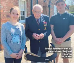  ?? BBC/PA WIRE ?? Colonel Tom Moore with his grandchild­ren, Benji and
Georgia
