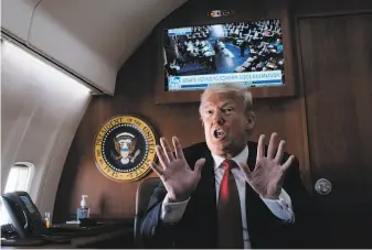  ?? Pete Marovich / New York Times ?? President Trump speaks to reporters aboard Air Force One on Oct. 6 as the Senate votes to confirm Brett Kavanaugh. Trump has united his followers around a message of division.