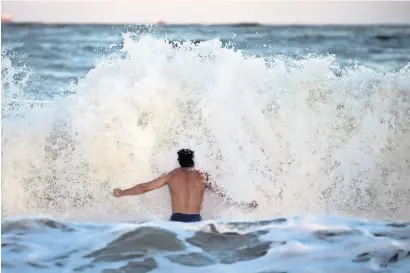  ?? — AP ?? Body surfer Andrew Vanotteren, of Savannah, crashes into waves from Hurricane Florence, on the south beach of Tybee Island.