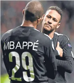  ?? Pictures: SNS Group. ?? Top: Celtic’s Stuart Armstrong looks on dejected as PSG players celebrate making it 3-0 through Edinson Cavani’s penalty-kick just before half-time; above: Neymar with Kylian Mbappe after the £166m-rated teenager made it 2-0 to the French side.