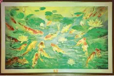  ??  ?? The exhibit also features original works by Chan Lim like this Chinese oil painting of koi fish. Many believe that the koi symbolizes good luck, abundance and perseveran­ce.