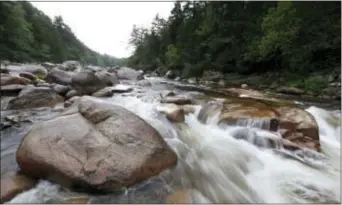  ?? ROBERT F. BUKATY - THE ASSOCIATED PRESS ?? In this 2015 file photo, the Wassataquo­ik Stream flows through Township 3, Range 8, Maine, on land owned by environmen­talist Roxanne Quimby, the co-founder of Burt’s Bees personal care products company. Quimby’s foundation donated the area in August...