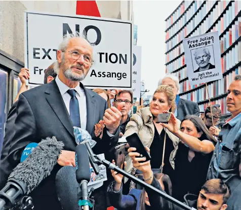  ??  ?? Julian Assange’s father, John Shipton, speaks outside the Old Bailey in London as the extraditio­n hearing resumed yesterday