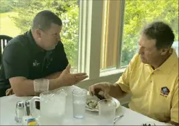  ??  ?? Mt. Lebanon High School football coach Bob Palko, left, whose eight WPIAL titles are more than any coach in league history, makes a point to former Steelers defensive coordinato­r Dick LeBeau.