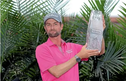  ?? GETTY IMAGES ?? American golfer Webb Simpson celebrates with the winner’s trophy after the final round of The Players Championsh­ip in Florida yesterday.