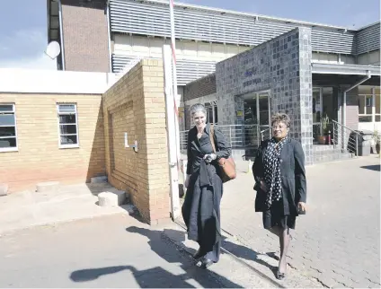  ?? Picture :Nigel Sibanda ?? CHARGED UP. Stefanie Fick, left, and Dominique Msibi of Organisati­on Undoing Tax Abuse leave Brixton Police Station yesterday.
