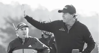  ?? Harry How / Getty Images ?? Phil Mickelson celebrates on the 18th green Monday after closing out his fifth AT&amp;T Pebble Beach Pro-Am title. Mickelson will be competing on the same course at the U.S. Open in June.