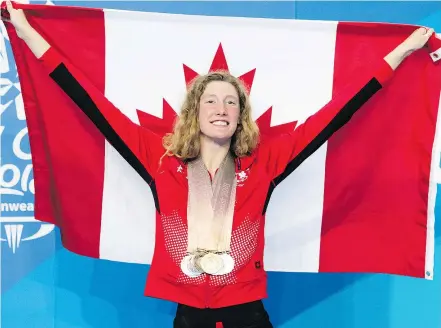  ?? — THE CANADIAN PRESS FILES ?? Canadian Taylor Ruck, 17, won eight swimming medals at the Commonweal­th Games in Gold Coast, Australia, tying the record for most medals won at a single Games.