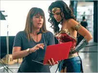  ?? CLAY ENOS/WARNER BROS. VIA WASHINGTON POST ?? Director Patty Jenkins and actress Gal Gadot work on the set of Wonder Woman 1984.