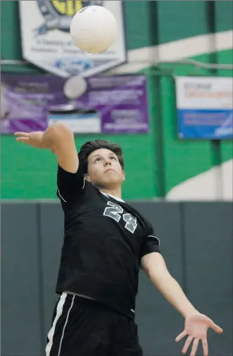  ?? Nikolas Samuels/The
Signal ?? Canyon’s Fabian Ruiz (24) throws the ball up to serve it during a home game against Golden Valley on Thursday.