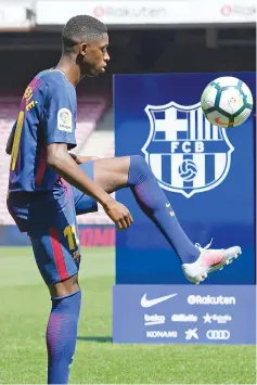  ?? AFP photo ?? Barcelona’s new player Ousmane Dembele controls a ball at the Camp Nou stadium in Barcelona, during his official presentati­on by the Catalan football club, on August 28, 2017.—