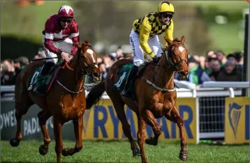  ??  ?? Samcro and Davy Russell (maroon colours) pipping Paul Townend and Melon at Cheltenham last year. Samcro’s first race was at Monksgrang­e, Rathnure.