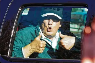  ?? Steve Helber / Associated Press ?? President Donald Trump gives two thumbs up to supporters on Sunday as he departs after playing golf at the Trump National Golf Club in Sterling, Va. Joe Biden was declared the president-elect on Saturday.