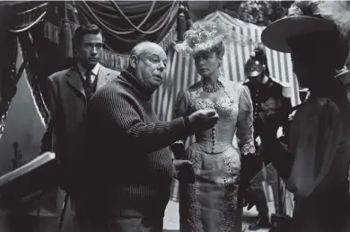 ??  ?? Jean Renoir with Mel Ferrer and Ingrid Bergman on the set of 1956