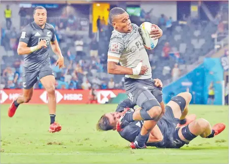  ??  ?? Napolioni Bolaca on attack against New Zealand in their second pool match during the HSBC Sydney 7s tournament at the Bankwest Stadium in Australia earlier this year. Picture: JONACANI LALAKOBAU