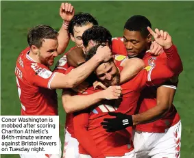  ??  ?? Conor Washington is mobbed after scoring Charlton Athletic’s 84th-minute winner against Bristol Rovers on Tuesday night.