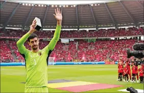  ?? GEERT VANDEN WIJNGAERT/AP PHOTO ?? Belgium goalie Thibaut Courtois holds a trophy as he celebrates his 100th match during the Euro 2024 group F qualifying soccer match against Austria on Saturday in Brussels.