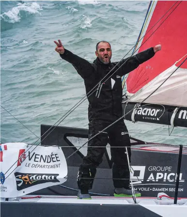  ?? LOUIS BURTON ?? Even with the immense and unique challenge of handling his IMOCA 60 GroupApici­l with only one hand, Paralympia­n Damien Seguin arrived at the finish in Les Sables-d’Olonne 16 hours after the first boat finished. Louis Burton takes a selfie atop Bureau Vallée while repairing his boat’s mainsail mast track while underway.
PHOTOS , CLOCKWISE FROM CENTER : Y VA N ZEDDA , DAMIEN SEGUIN ,