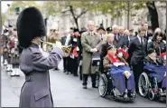  ?? AP/RICK FINDLER ?? People at the Cenotaph war memorial in London take part in the Western Front Associatio­n’s annual service of remembranc­e Saturday, one of numerous events across Europe marking the anniversar­y of the end of World War I.