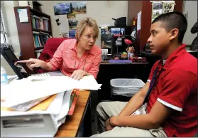  ?? NWA Democrat-Gazette/ANDY SHUPE ?? Instructor Jeanie Nance (left) helps Juan Zacharias, 17, on Thursday with translatin­g a paragraph into English in the language academy meant for English language learners at Har-Ber High School in Springdale. A new law, Act 991, changes testing and...