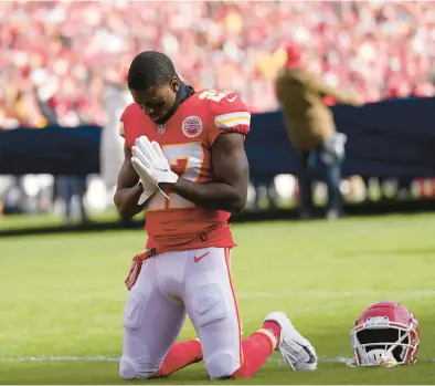  ?? AP FILE ?? Chiefs cornerback Rashad Fenton kneels on the field and prays before the AFC championsh­ip game against the Bengals on Jan. 30.