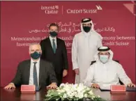  ?? ?? IPA Qatar CEO Sheikh Ali Alwaleed Al Thani and Credit Suisse Group CEO Thomas Gottstein sign the agreement.