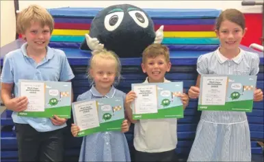  ??  ?? Pupils Taylor, Jasmine, Noah and Elizabeth from Godinton Primary School helped raise £3,500 for the NSPCC